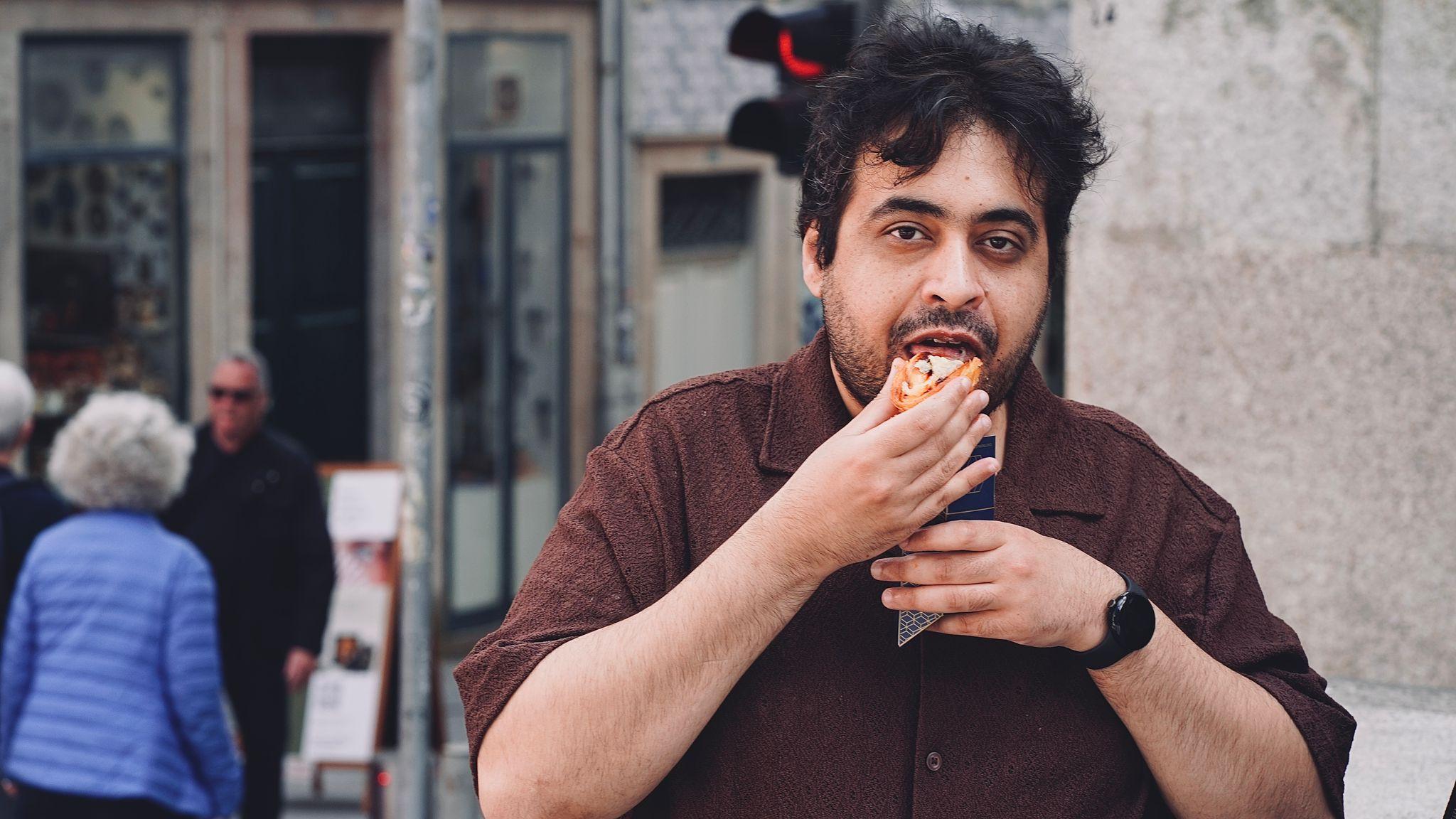 Ahmed H. Ismail on a city street, looking at the camera